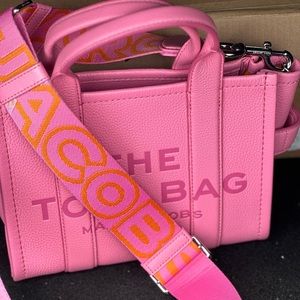 Mini leather Marc jacobs bag. Never been used. Bought with the thick strap.